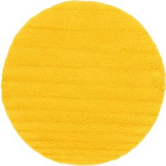 a round yellow area rug on a white background