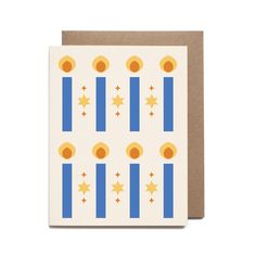 a white card with blue and yellow stripes, stars and circles on the front of it