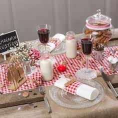 the table is set with cookies, milk and crackers for a festive occasion