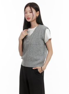 Product Detail Style : Casual, Minimal Occasion : Work wear Detail : Cable Print : Solid Material : Polyester, Spandex, Knit Sleeve : Sleeveless Neck : V neck Polyester95 Spandex5 Color : Gray, Dark blue, Beige Made in Korea Model Size Model is wearing size S/M and the color Gray. Height : 5'5" | 165cm / Top : S / Bottom : S (26 inch) .prddescription table, .prddescription td, .prddescription th { border : 1px solid black; border-collapse : collapse; padding: 10px; } Size(Inch) Size Shoulder Bus Casual Knitted V-neck Tank Top, Gray Stretch Vest, Casual Gray Knitted Sweater Vest, Stretch Knit V-neck Vest, Casual Stretch Knitted Vest, Gray Fitted V-neck Sweater Vest, Gray Knit Sleeveless Tank Top, Casual V-neck Vest, Gray Knit Sleeveless Sweater Vest