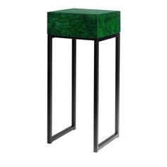 a small green table with black legs