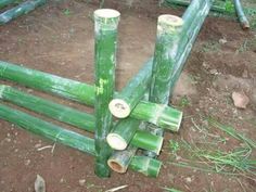 several bamboo poles laying on the ground