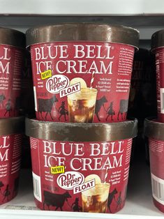 several ice creams are stacked on top of each other in a store display case