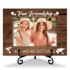 two girls with hats on their heads and the words true friends knows no distance in front of them