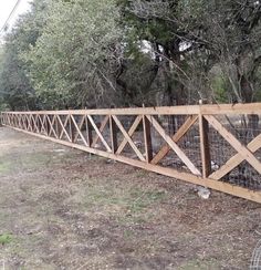 the fence is made of wood and wire