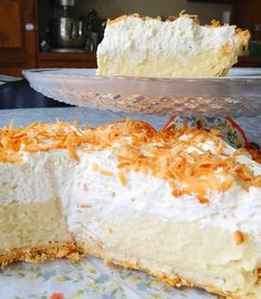 a large piece of cake sitting on top of a table next to a pie pan