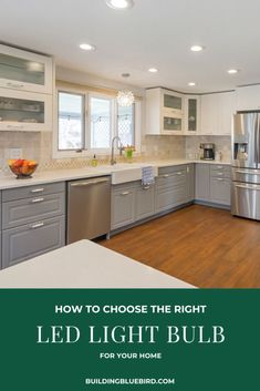 a kitchen with stainless steel appliances and white cabinets is featured in the article how to choose the right led light bulb for your home