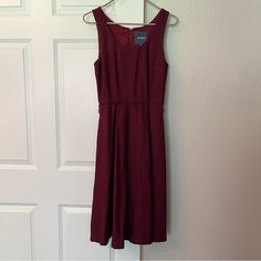 Modcloth Dress Size 2 Wool Blend Sleeveless Swing Dress. Lined, With Flared Skirt And Hidden Pockets. Wine/Maroon Color, Missing Belt. Back Zipper With Hook And Eye Closure. Dress: 50% Wool, 30% Polyester, 20% Rayon Lining: Polyester. Good Condition, Never Worn, Just Kept In The Closet. Shoulder To Hem: 41” Bust: 32” Waist: 26” Hips: Free Chic Burgundy Sleeveless Midi Dress, Sleeveless Burgundy Dress For Spring, Chic Sleeveless Burgundy Dress, Burgundy Sleeveless Dress For Spring, Chic Burgundy Sleeveless Dress, Burgundy Sleeveless Summer Dress, Casual Burgundy Sleeveless Dress, Modcloth Dress, Mod Cloth Dresses