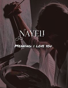 a woman painting on the side of a wall with text that reads nayei meaning love you