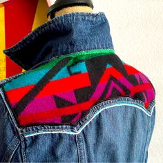 Upcycled Ladies True Religion Denim Jacket Pendleton Wool Yolk And Inside Collar Hand Chainstitched Detail Blue Denim Multi Colored Pendleton Jacket 98%Cotton | 2% Spandex Chest Measurement: 16.5" Pit To Pit Jacket Length: 20.5" Long From Collar Seam To Bottom Hem Sleeve Length: 25" From Shoulder Seam To End Of Cuff Snap Closure (Not Buttons) Machine Washable But Do Not Tumble Dry. Lay Flat To Dry Fall Blue Denim Patchwork Vest, Blue Patchwork Denim Vest For Fall, Blue Reworked Denim Jacket For Fall, Fall Blue Patchwork Denim Vest, Retro Blue Denim Vest For Fall, Vintage Multicolor Denim Outerwear, Western Blue Denim Jacket For Fall, Western Denim Vest For Fall, Gap Blue Denim Jacket For Fall