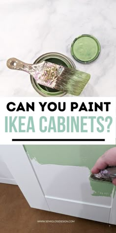 someone is painting the cabinets with green paint