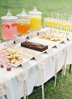 a table topped with lots of desserts and drinks