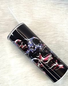 a black and white cup with some designs on it