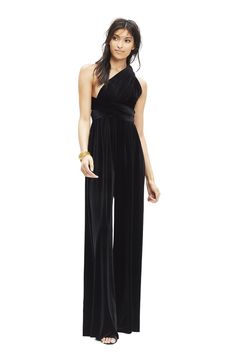 Our convertible Velvet Jumpsuit is perfect for the bridal party, rehearsal dinner, brunch, work and anywhere in between. It features our signature convertible wrap top and can be tied over 15 different ways. Two sizes fits all—size A fits US 0-12 and size B fits a US 14-24 Standard Length Measures 47" long. Please inquire about extra length options Fabric: Luxurious Poly-Spandex Velvet Care: Dry-Clean Only. Hang Dry. Steam Only, Do Not Iron Made in the USA Please see our FAQ for information on b Elegant Evening Jumpsuit With Tie Back, Chic Evening Jumpsuit With Tie Back, Evening Jumpsuits And Rompers With Tie Back, Black Velvet Jumpsuit, African Print Jumpsuit, Bridesmaids Jumpsuits, Velvet Bridesmaid, Velvet Bridesmaid Dresses, Bridal Jumpsuit