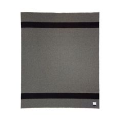 a gray and black blanket on a white background