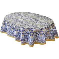 a blue and yellow table cloth with an ornate design on it, sitting on top of a