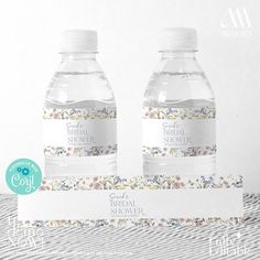 two bottles of water sitting next to each other