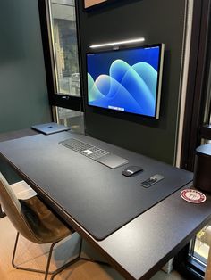 a desktop computer sitting on top of a wooden desk