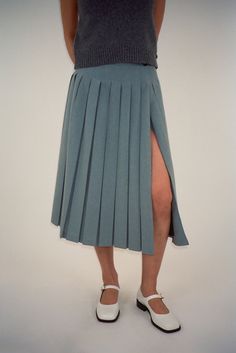 Pleated midi length skort in GreyFeatures built in shorts Fully lined Made in NYC Fits true to sizeModel is 5'9 and wearing a size 4 Size Length Waist Hip 0 29 1/2" 26 1/2" 38" 2 29 3/4" 27 1/2" 39" 4 30" 28 1/2" 40" 6 30 1/4" 29 1/2" 41" 8 30 1/2" 30 1/2" 42" 10 30 3/4" 31 1/2" 43" 12 31" 33" 44 1/2" 100% Polyester Size Guide + Shipping Info Monthly payments available at checkout with Affirm. Nyc Fits, Monthly Payments, Hair Socks, Uniform Dress, Sandy Liang, Knit Outerwear, Pleated Skirts, Mode Inspiration, Skirt Pants