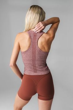 Our Energy Tank is designed for high performance activities as well as for on the go. This seamless tank is fitted yet flexible and hits at the top of the waistband. Seamless Racerback Activewear With 4-way Stretch, Athleisure Compression Seamless Tank Top, Seamless Compression Tank Top For Athleisure, Compression Seamless Tank Top For Light Exercise, Compression Seamless Tank Top For Workout, Seamless Compression Tank Top For Workout, Breathable Stretch Tank Top, Sleeveless Seamless Athleisure Activewear, Sleeveless Seamless Fabric Athleisure Activewear