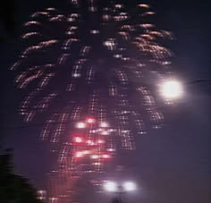 fireworks are lit up in the night sky