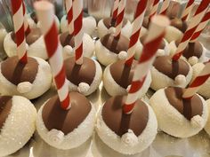 chocolate covered desserts with candy sticks sticking out of them