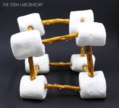 marshmallows are arranged in the shape of cubes with sticks sticking out of them