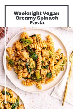 a white plate topped with pasta and broccoli