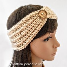 a close up of a mannequin head wearing a knitted headband