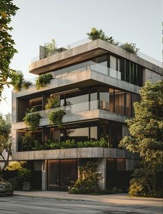 an apartment building with plants growing on the balconies