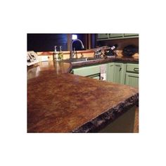 a counter top in a kitchen with green cabinets