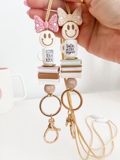 🍎 These beautiful neutral lanyards feature cute bow-wearing smileys, books, and coffee mugs! They are ideal to hold keys and ID badge for easy access! They would would make the perfect gift for your favorite teacher! 🍎  📓 The listing is for one (1) lanyard 📓 📚 SIZE: 20" Inches from breakaway clasp to keyring ♥  🍎 NOTE: The breakaway clasp color may vary but it will always match the lanyard.  ✏️ Please message me if you need a longer or shorter size ITEM DETAILS  ⭐ Washable soft silicone beads ⭐ Acrylic beads ⭐ Metal lobster clasp that includes a swivel ring ⭐ Sturdy nylon cord ⭐ Breakaway clasp  NOTE: The breakaway clasp should only be used to release the necklace from any accidental catches, not as a way to take on or off the lanyard.  ⚠️ WARNING: This item contains small parts that Silicone Bead Lanyards, Focal Bead Ideas, Neutral Books, Silicone Bead Lanyard, Swivel Ring, Daisy Beads, Coffee Teach Repeat, Beaded Pens, Lanyard Necklace