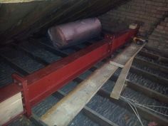 a red conveyor belt in an attic