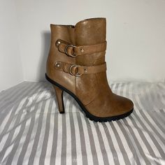 Color: Oil Rubbed Taupe Size: 6.5m Heel Height: 4" Features: Inside Zipper Double Buckle Detail Silver Hardware Rubber Lug Sole New & Never Worn **Small Scuff On Back Of Right Shoe Above Heel (See Pics) Fall Ankle Strap Boots With 4-inch Heel, Fall Platform Heeled Boots With Ankle Strap, Brown Ankle Strap Heeled Boots For Spring, Brown Heeled Boots With Ankle Strap For Spring, Brown High Heel Platform Boots With Padded Ankle, Brown Ankle Strap Heeled Boots With Reinforced Heel, Brown High Heel Boots With Padded Ankle, Brown Heeled Boots With 4-inch Heel And Round Toe, Brown Heeled Boots With 4-inch Round Toe