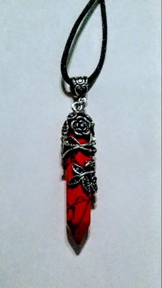 This is a beautiful reconstituted red stone with dragon veins dagger point pendant. It is wrapped in antique silver metal flowers and leaves! I hung this on an 18 inch black satin cord and added a two inch extender chain so you can adjust the length! This necklace is absolutely gorgeous and would Emo Jewelry, Edgy Jewelry, Idee Cosplay, Pola Gelang, Animale Rare, Magical Jewelry, Dragon Jewelry, Stone Pendant Necklace, Red Dragon