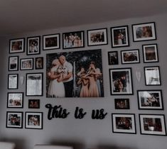 a wall with many pictures on it that says this is us