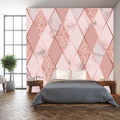 a bedroom with a bed, nightstands and a wallpapered design on the wall