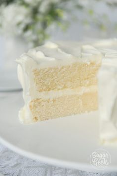 a slice of white cake sitting on top of a plate