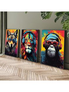 three paintings of animals wearing headphones and sunglasses on the wall next to a plant