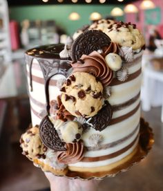 there is a cake with cookies and chocolate chips on it