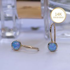 Unique Blue Opal Earrings, made of 14K Solid Yellow Gold, Round Shaped, Fine Jewelry for Women, Handmade By AditaGold.  These beautiful handmade round blue opal earrings are made of 14K yellow gold and are carefully handcrafted at my workshop in Israel.  Opal is October's birthstone, and these solid gold opal earrings will be perfect for any occasion. They are classic and elegant and will add a beautiful sparkle to a day or evening look.  Item details   * A pair of earrings. * Material: 14K Yell Formal Round Jewelry With Ear Wire, 14k Gold Drop Earrings With Lever Back Ear Wires, 14k Gold Round Earrings Fine Jewelry, 14k Gold Round Fine Jewelry Earrings, 14k Gold Round Cut Earrings For Pierced Ears, 14k Gold Round Cut Pierced Earrings, Formal 14k Gold Earrings With Ear Wire, Round 14k Gold Fine Jewelry Earrings, 14k Gold Drop Earrings With Bail