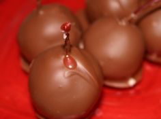 chocolate candies sitting on top of a red table