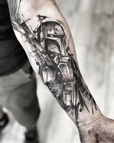 a man's arm with a star wars tattoo on it