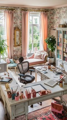 a living room filled with furniture and a large window next to a desk covered in books