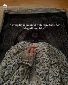 someone is laying down in bed with their hand on the pillow that says,'everyday is beautiful with far, zari, azr,