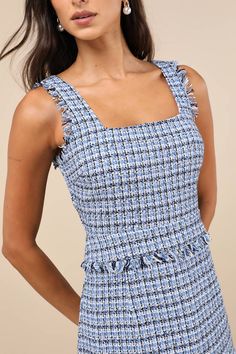 It's easy to become a style icon with pieces like the Lulus Adorably Luxurious Blue Tweed Raw Edge Sleeveless Mini Dress! Woven tweed fabric, with a blue, white, and black design throughout, shapes tank straps and a flattering square neckline. Darted bodice continues down to a fitted waist, atop a lightly flaring skirt with a flounce-trimmed mini hem. Raw-edge trim at the arms and waist completes the look. Hidden zipper/clasp at back. Fit: This garment fits true to size. Length: Mid-thigh. Size Sleeveless Casual Tweed Dress For Summer, Casual Sleeveless Tweed Dress For Summer, Casual Sleeveless Summer Tweed Dress, Chic Blue Tweed Summer Dress, Sleeveless Blue Tweed Dress For Spring, Blue Sleeveless Tweed Dress For Spring, Fitted Blue Tweed Summer Dress, Blue Fitted Tweed Dress For Summer, Fitted Blue Tweed Dress For Summer