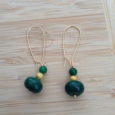 Emerald green jade Gold accent beads Gold ear wire Nickel free Gold Aventurine Beaded Jewelry, Gold Jade Jewelry With Faceted Beads, Green Jade Jewelry With Dangling Beads, Elegant Green Beaded Earrings With Gold Beads, Adjustable Green Beaded Earrings With Natural Stones, Green Adjustable Wire Wrapped Beaded Earrings, Green Beaded Dangle Earrings With Natural Stones, Elegant Jade Beaded Earrings With Round Beads, Elegant Jade Beaded Round Earrings