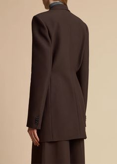 The Beckett Blazer in Dark Brown– KHAITE Sleek Structured Blazer For Semi-formal Occasions, Elegant Blazer Dress With Notch Lapel And Pressed Crease, Sleek Semi-formal Pantsuit With Pressed Crease, Tailored Structured Blazer Dress For Formal Occasions, Notch Lapel Tuxedo Blazer Dress For Work, Chic Blazer With Structured Boning For Business, Double Breasted Suit With Single Button For Workwear, Formal Double Breasted Suit For Workwear With Single Button, Sleek Business Blazer Dress With Suit Collar