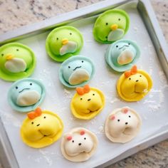 there are many small cupcakes in the shape of ducks on top of each other