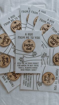 several pieces of white paper with brown and black words on them that say hug from me to you